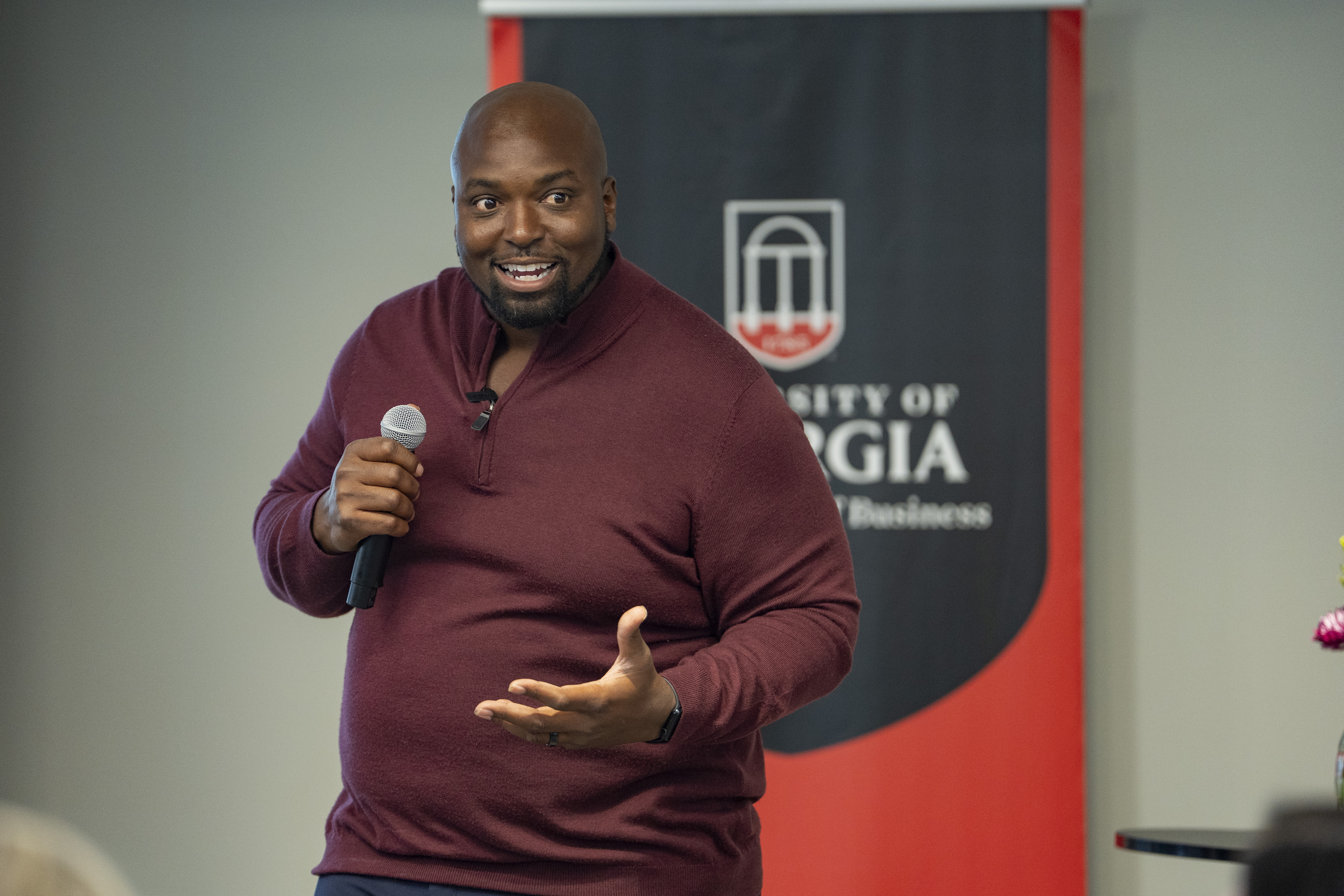 Fernando Velasco speaking with a microphone at the University of Georgia